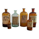 Lot of old glass perfumer bottles with original labels