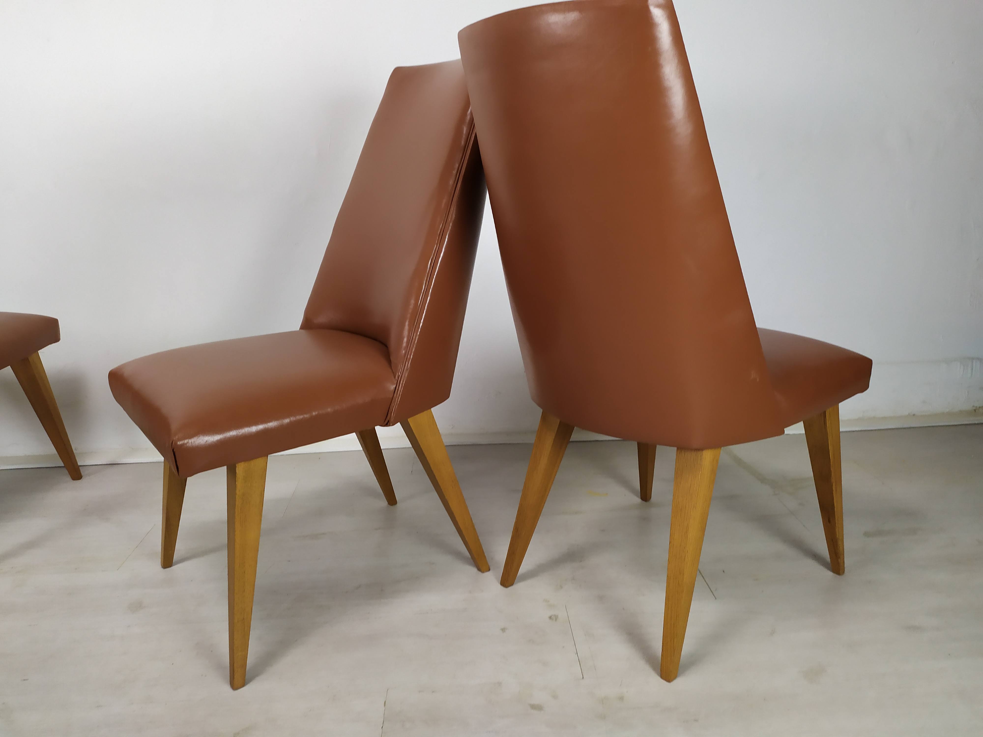 8 brown skai chairs 1950