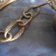 Vintage globe suspension in amber glass, chiseled floral decoration - 80s