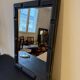 Patinated black rectangular wooden mirror