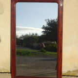 Large antique mirror in a flame mahogany frame; 132x82 cm