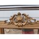 19th-century mirror in gilded wood and stucco.