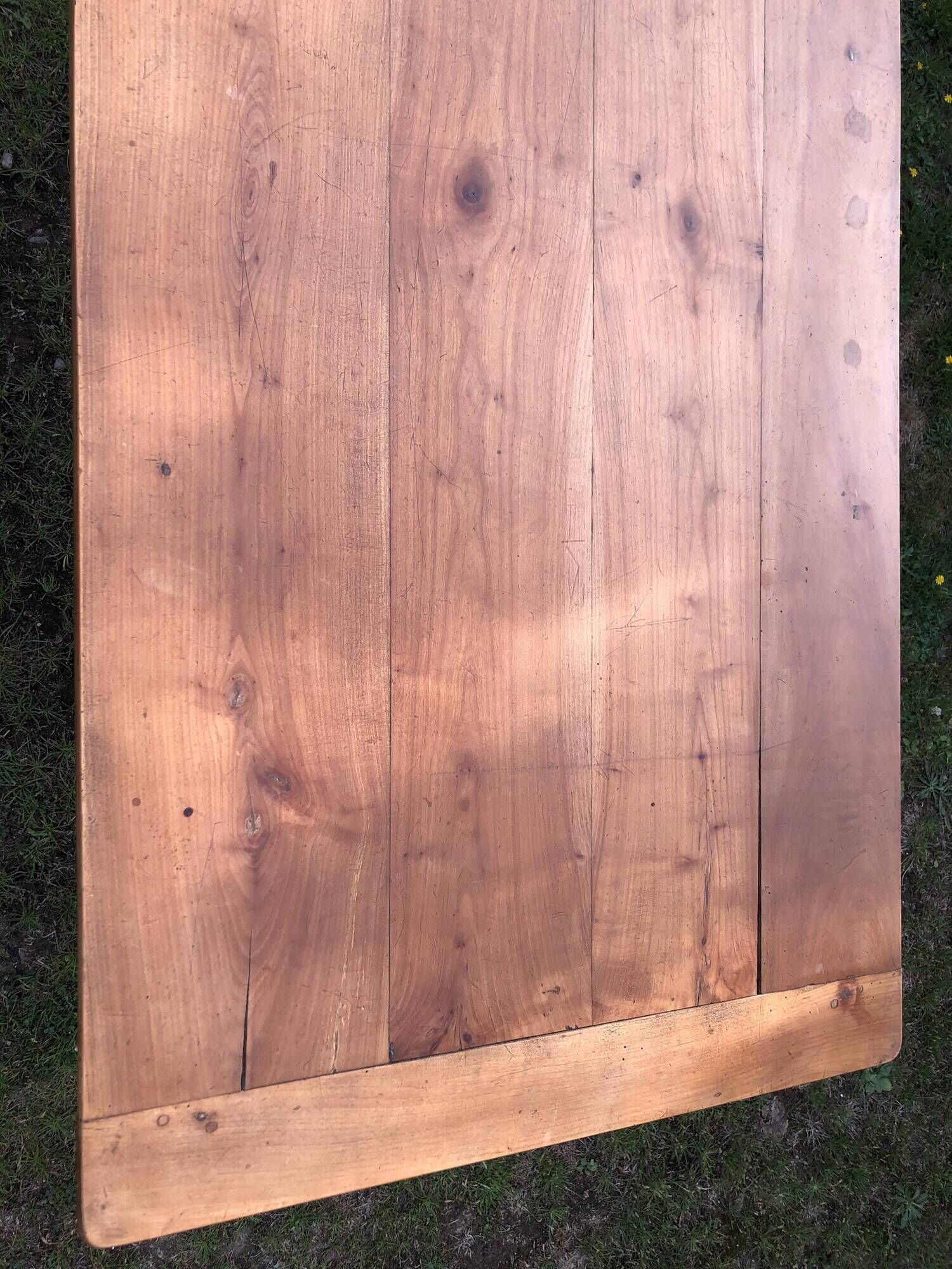Antique farmhouse table in solid cherry wood with 2 drawers and 1 pull-out at the end with turned legs.