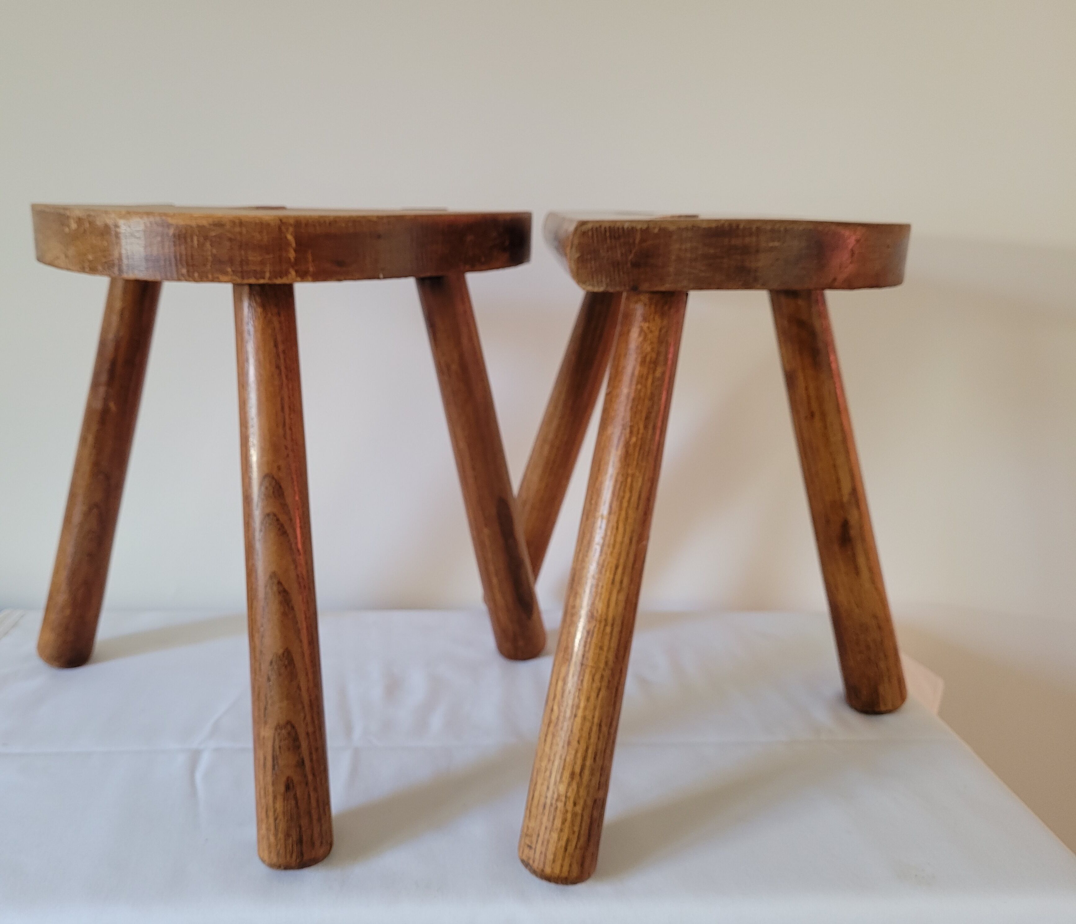 Pair of half-moon tripod stools