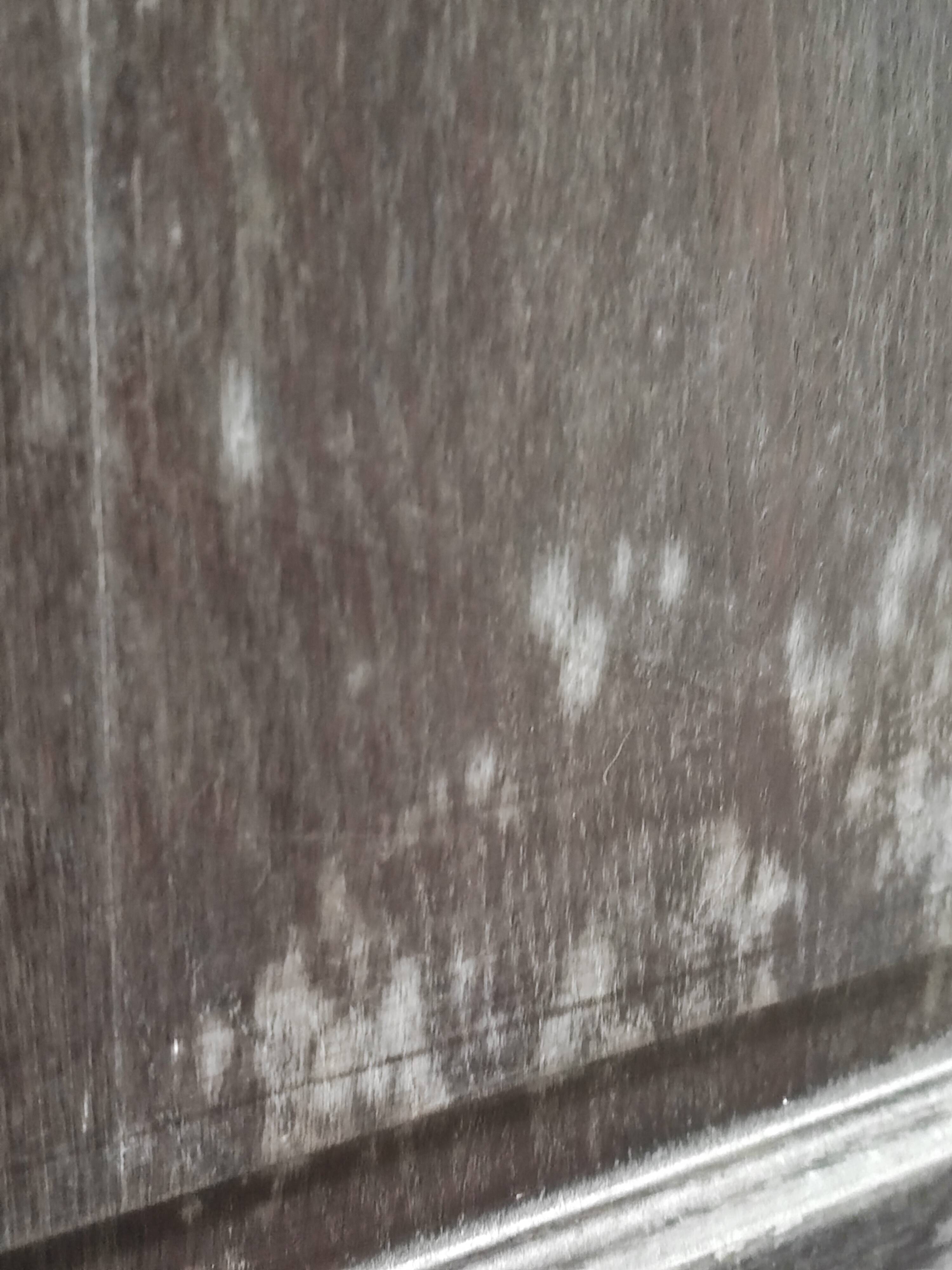 Bonnetière man standing cabinet a door