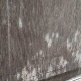 Bonnetière man standing cabinet a door