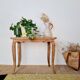 Antique coffee table with curved legs.