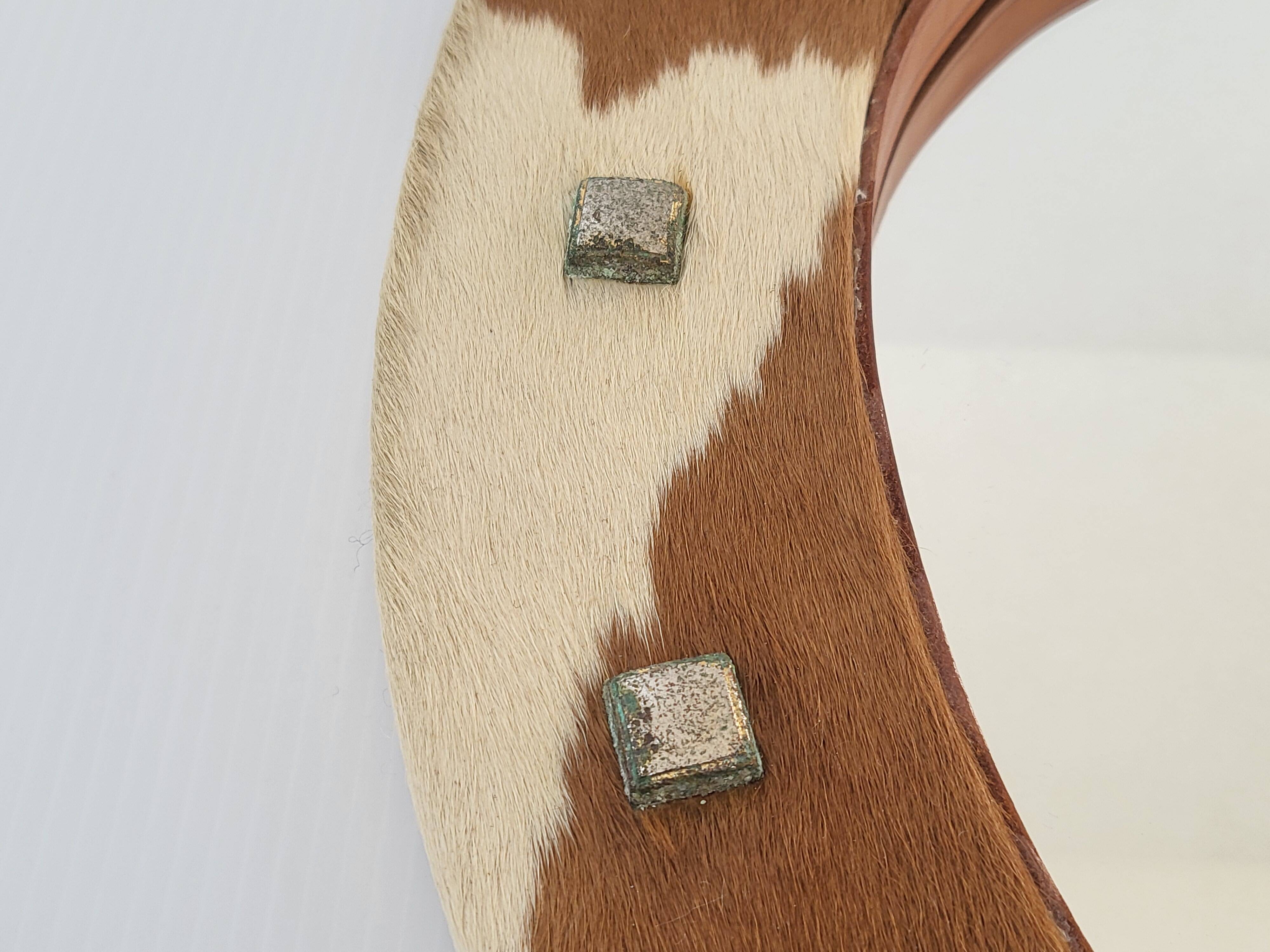 Vintage 1970s cowhide horseshoe mirror