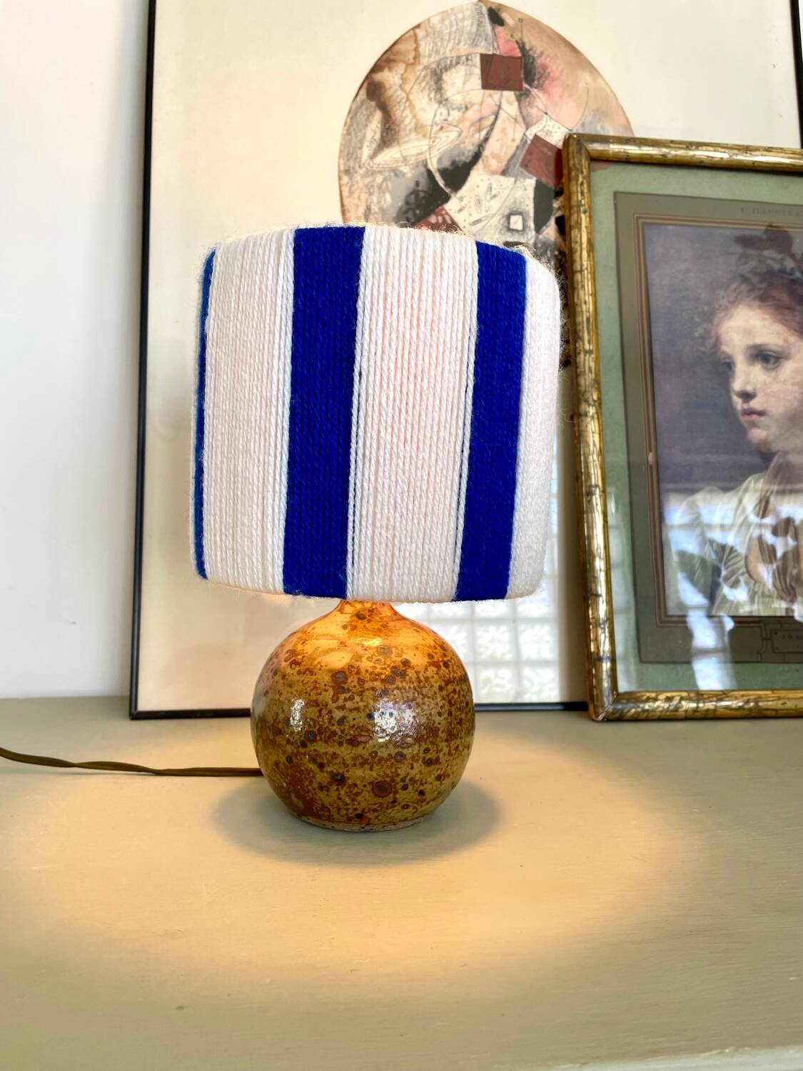 Vintage table lamp with pyrite sandstone base and striped wool lampshade