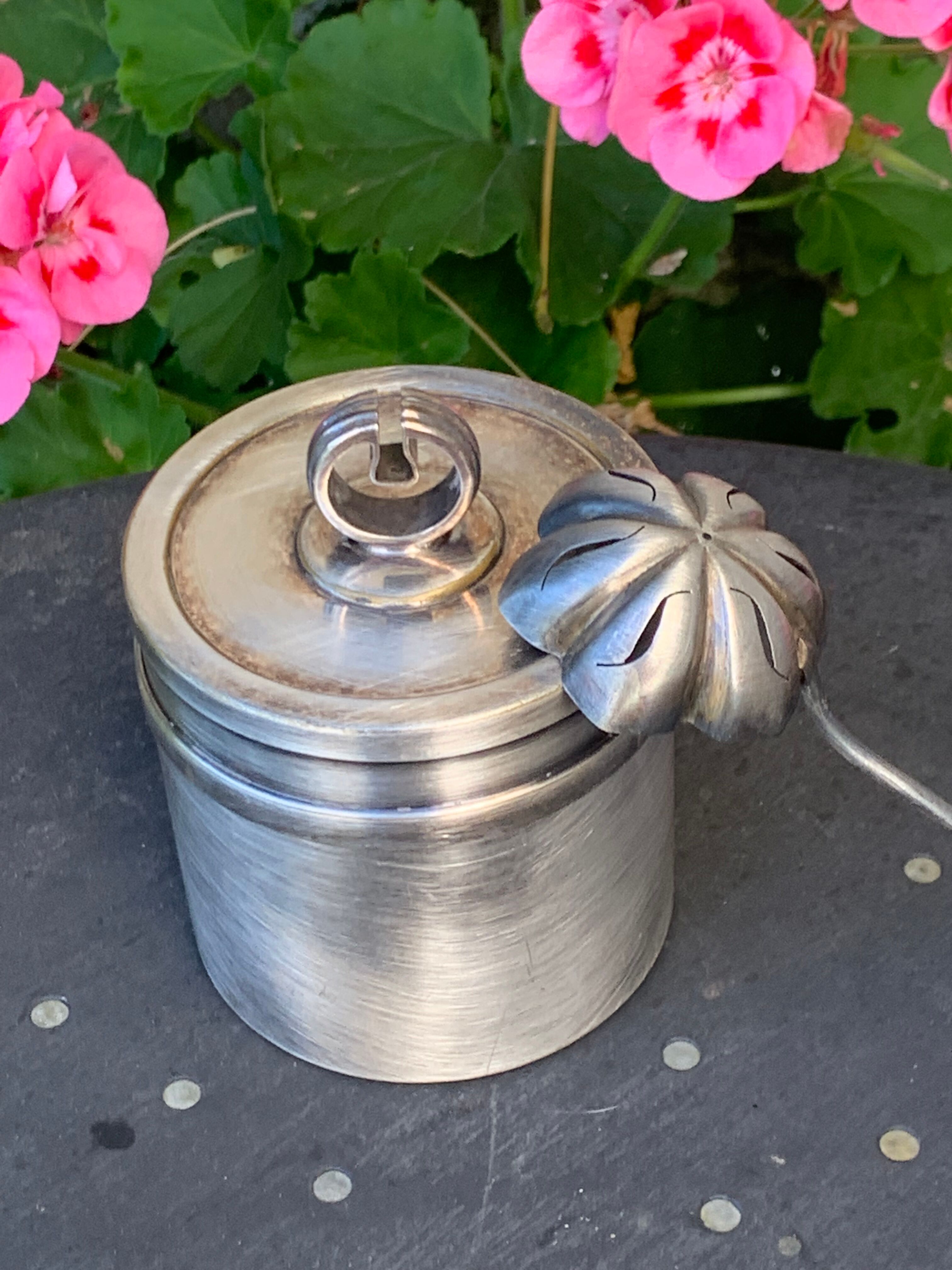 Sprinkling spoon and art deco sugar pot in silver metal