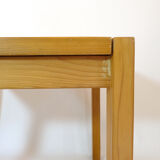 Pine dining table with extensions from the 1980s.