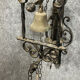 Wrought iron entrance bell depicting a monk ringing a bell circa 1900-1930