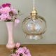 Suspension globe vintage en verre ambré
