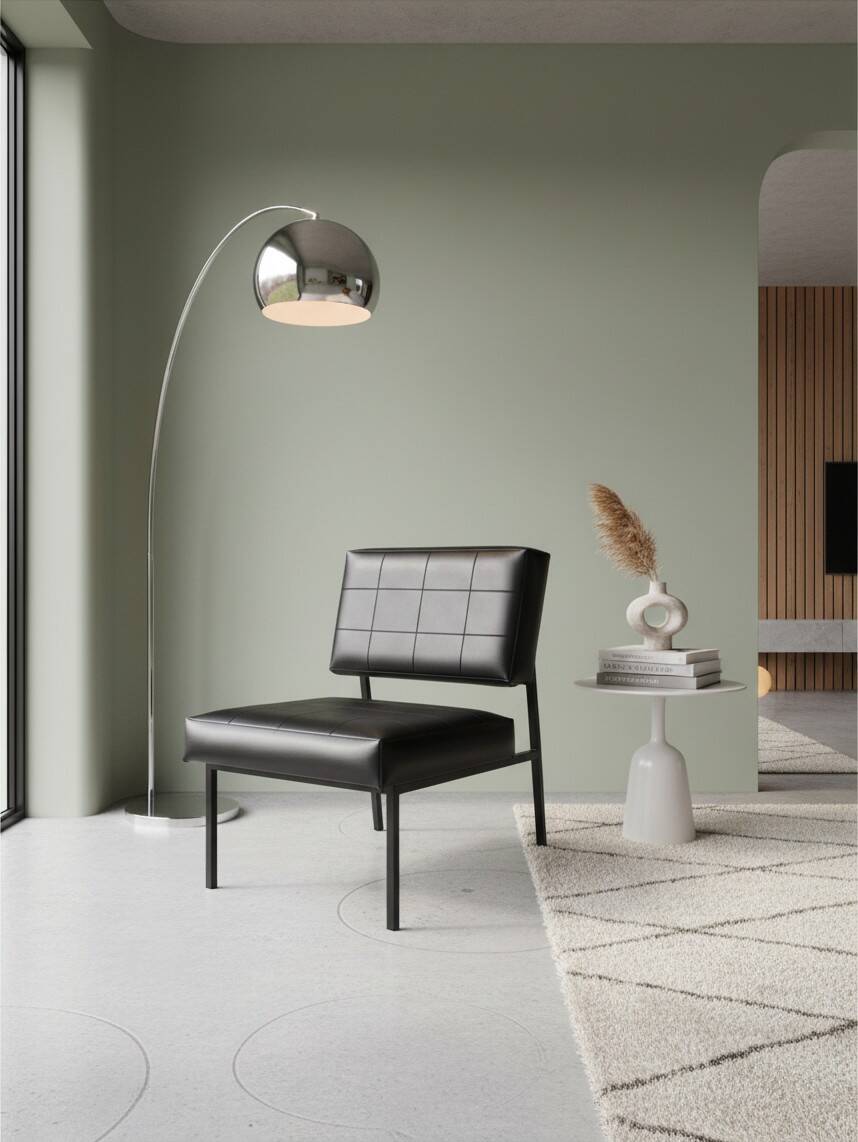 Modernist armchair in black faux leather and metal – 1960s