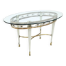 Table basse en laiton avec plateau en verre ovale dans le style de Pierluigi Colli, Italie