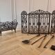 Wrought iron fire screen set with log basket, accessories.