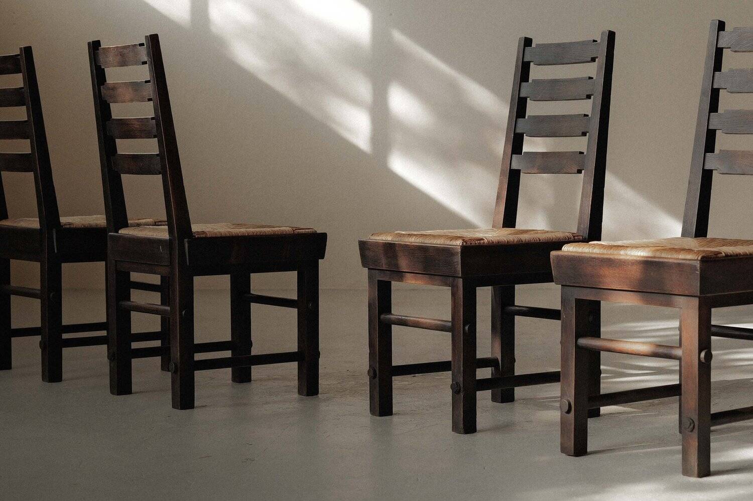 Modernist chairs in oak and woven straw, France, circa 1948