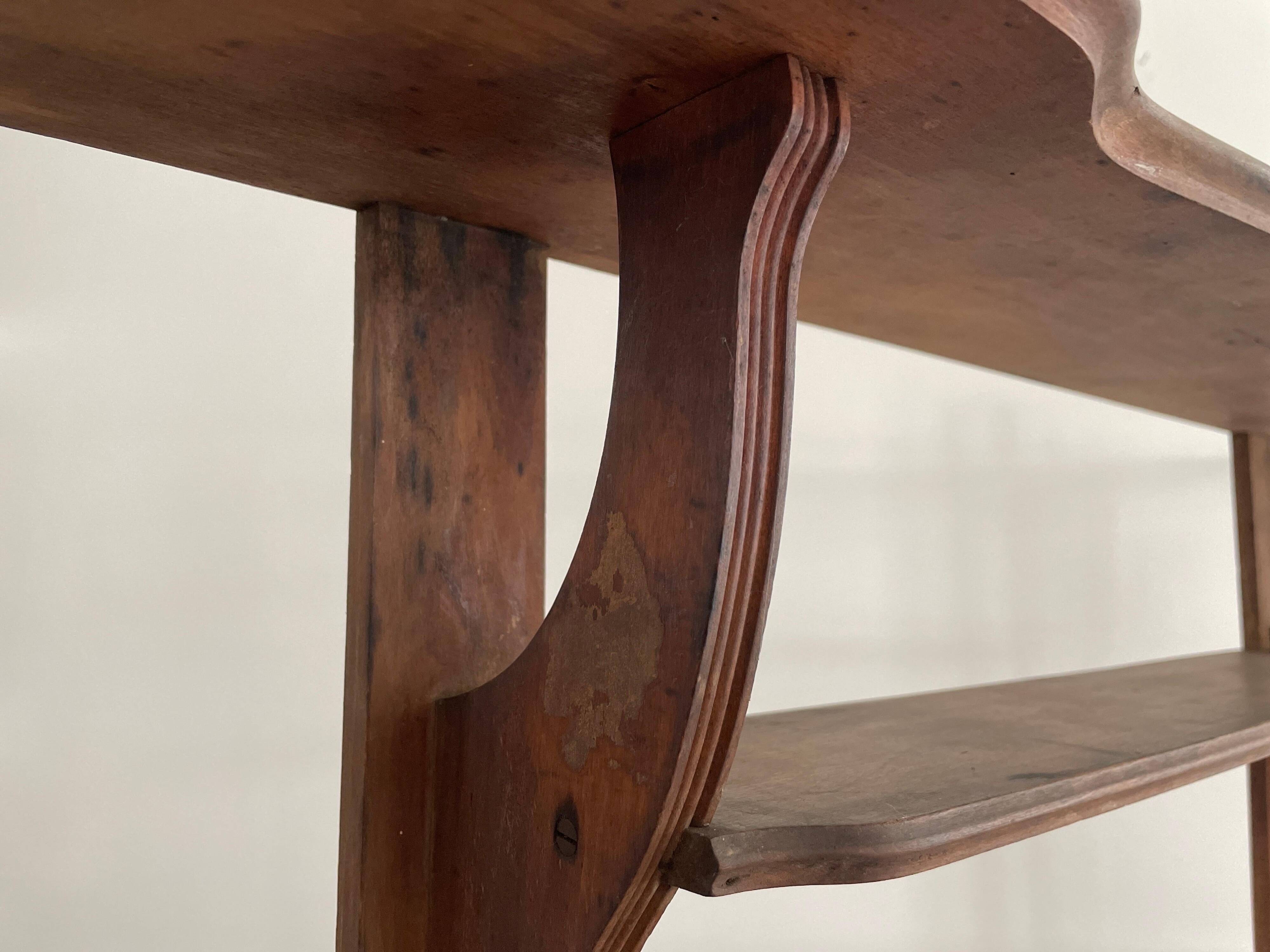 Art Deco wall shelf in wood with three levels, 1940s, Italy.