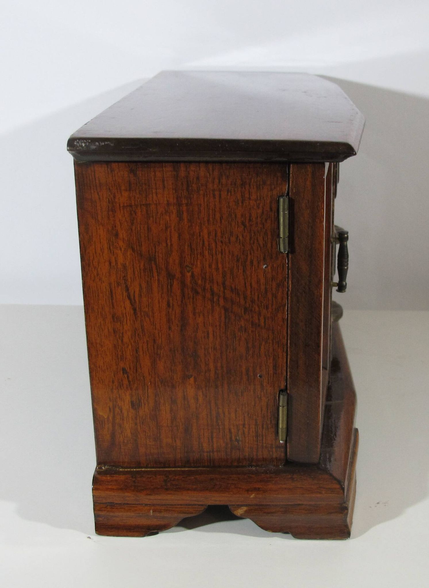Wooden jewelry box in the shape of a dresser