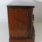 Wooden jewelry box in the shape of a dresser