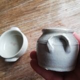 Set of 2 small glazed beige stoneware pots with handles