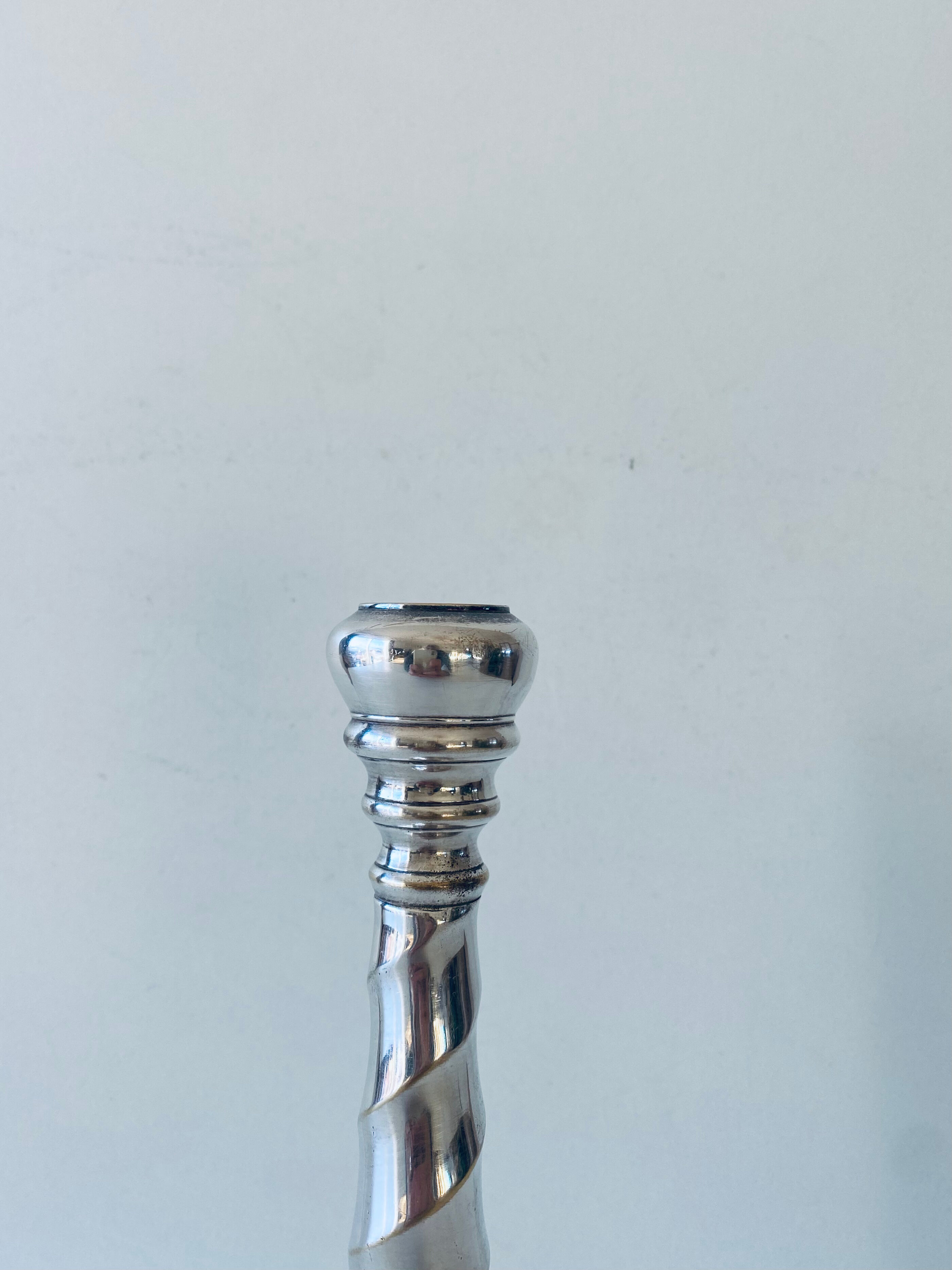 Twisted silver candle holder