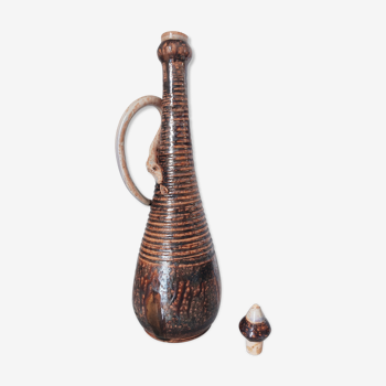 Marcellus Aubry covered bottle with snake