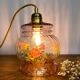 Vintage pink glass hand lamp with flower motifs