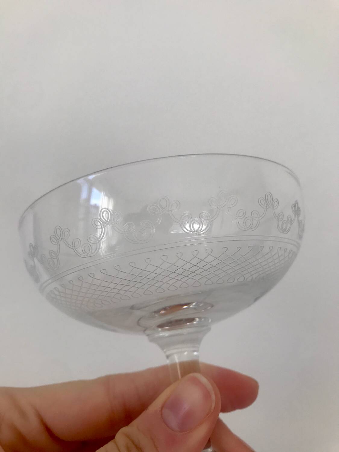 Set of 9 antique champagne glasses in engraved glass