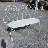Old garden bench in solid wrought iron