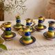 Many old glazed terracotta candlesticks.