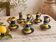 Many old glazed terracotta candlesticks.
