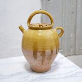 Old gargoulette pot in glazed terracotta