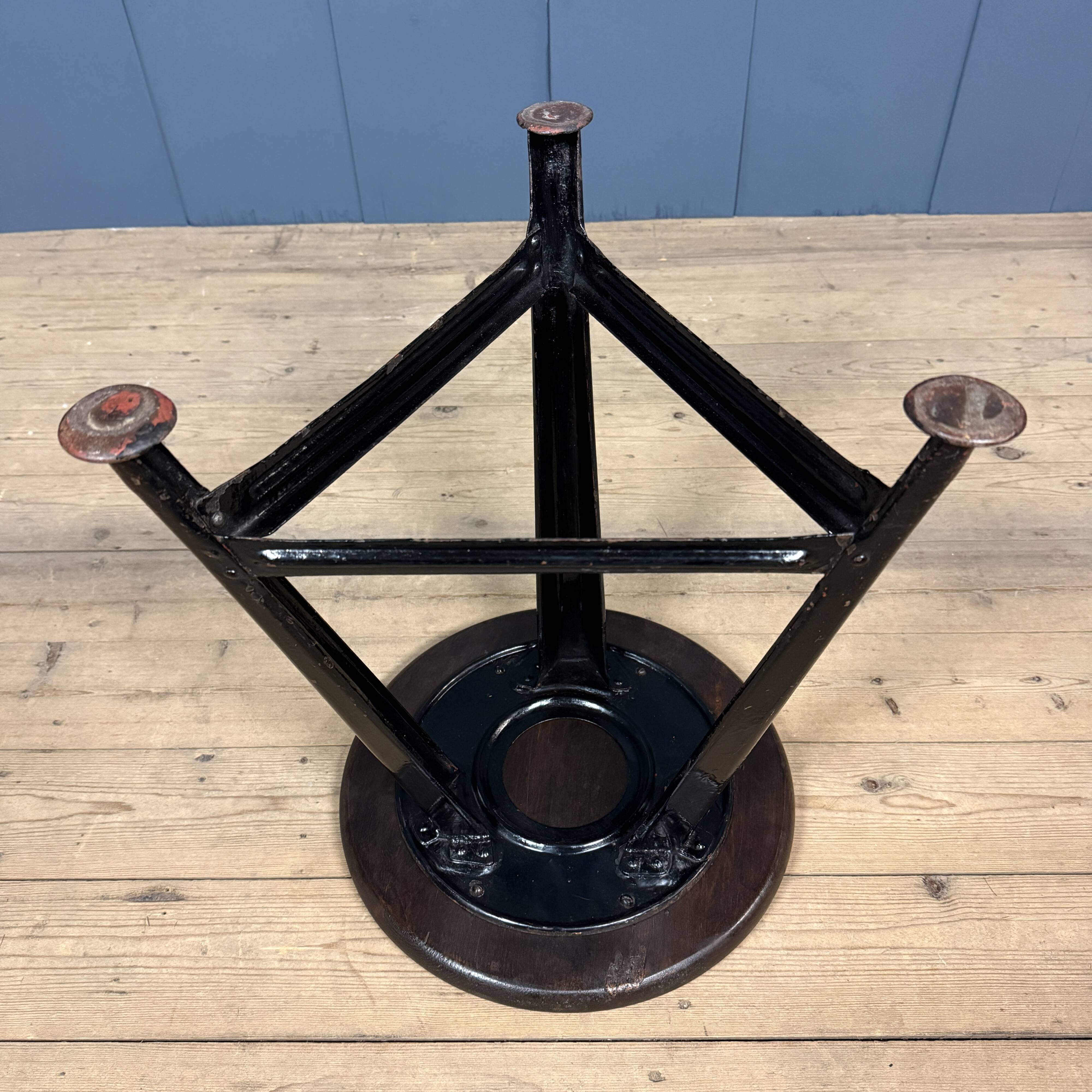 Unmarked black Rowac stool with a dark wood seat.