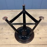 Unmarked black Rowac stool with a dark wood seat.