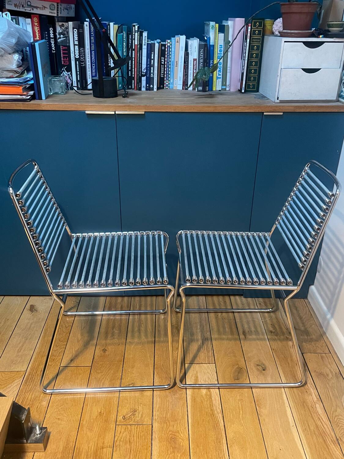 2 metal chairs with bungee cords