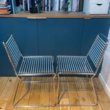 2 metal chairs with bungee cords