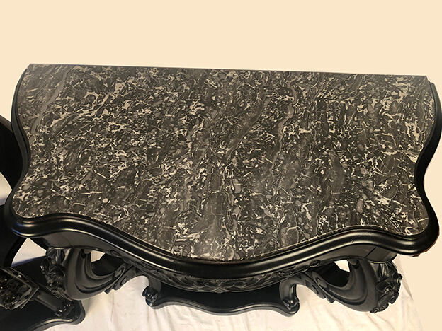 Pair of blackened wooden consoles, marble top