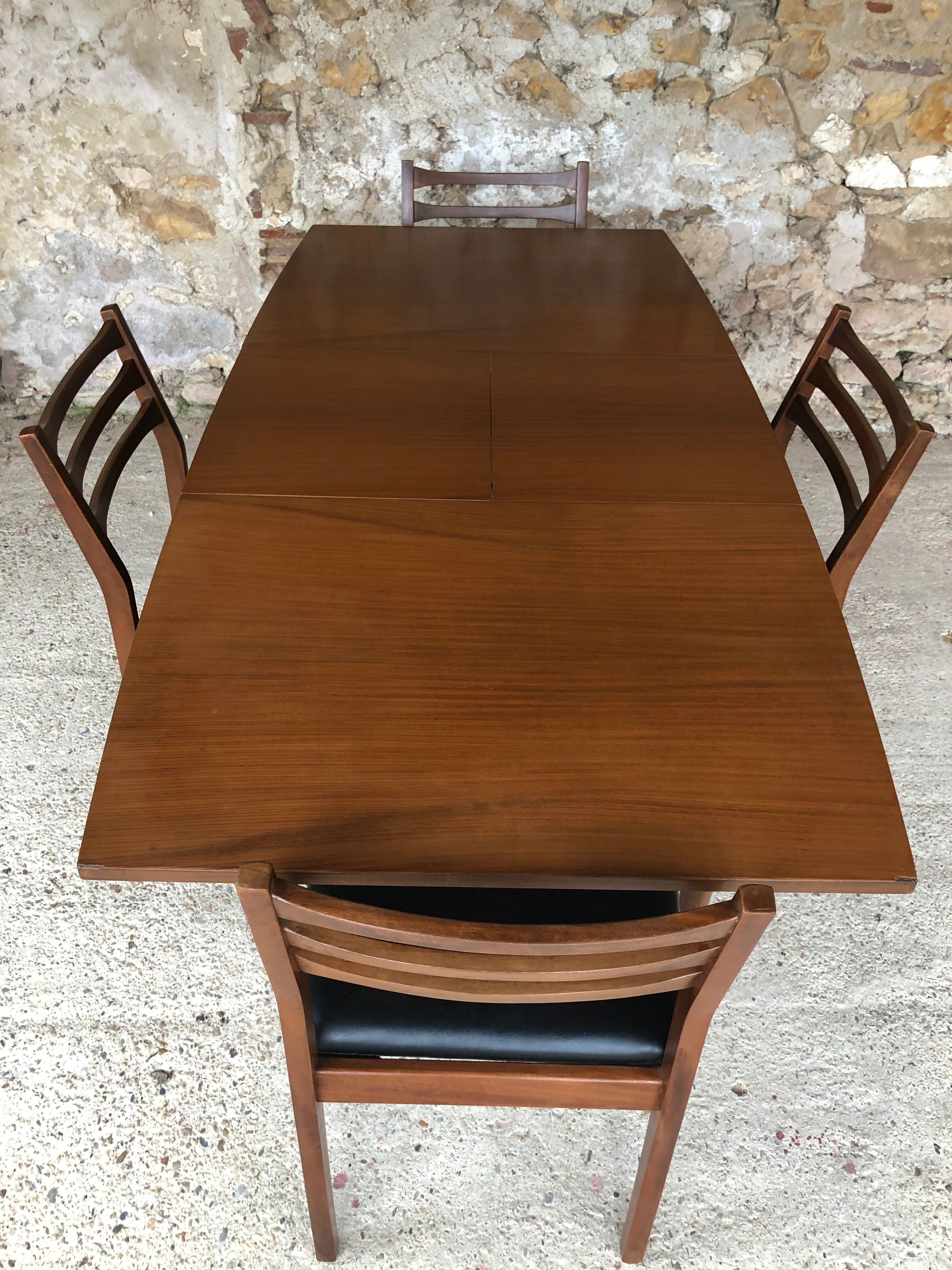 Scandinavian extension teak stretch table in butterfly ephardt by Meredew circa 60's