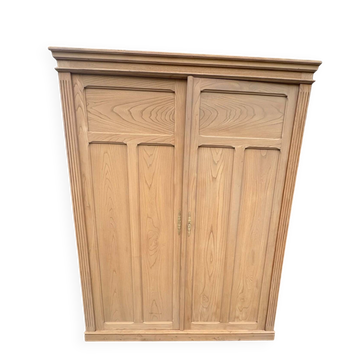 Large antique wardrobe in raw wood