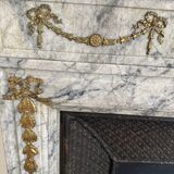Louis XVI fireplace in veined grey marble with original gilded bronzes from the 19th century.