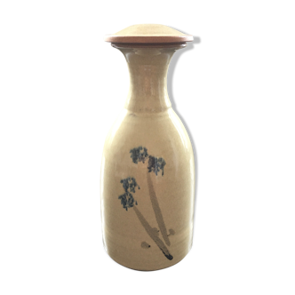 Stoneware carafe with floral decoration