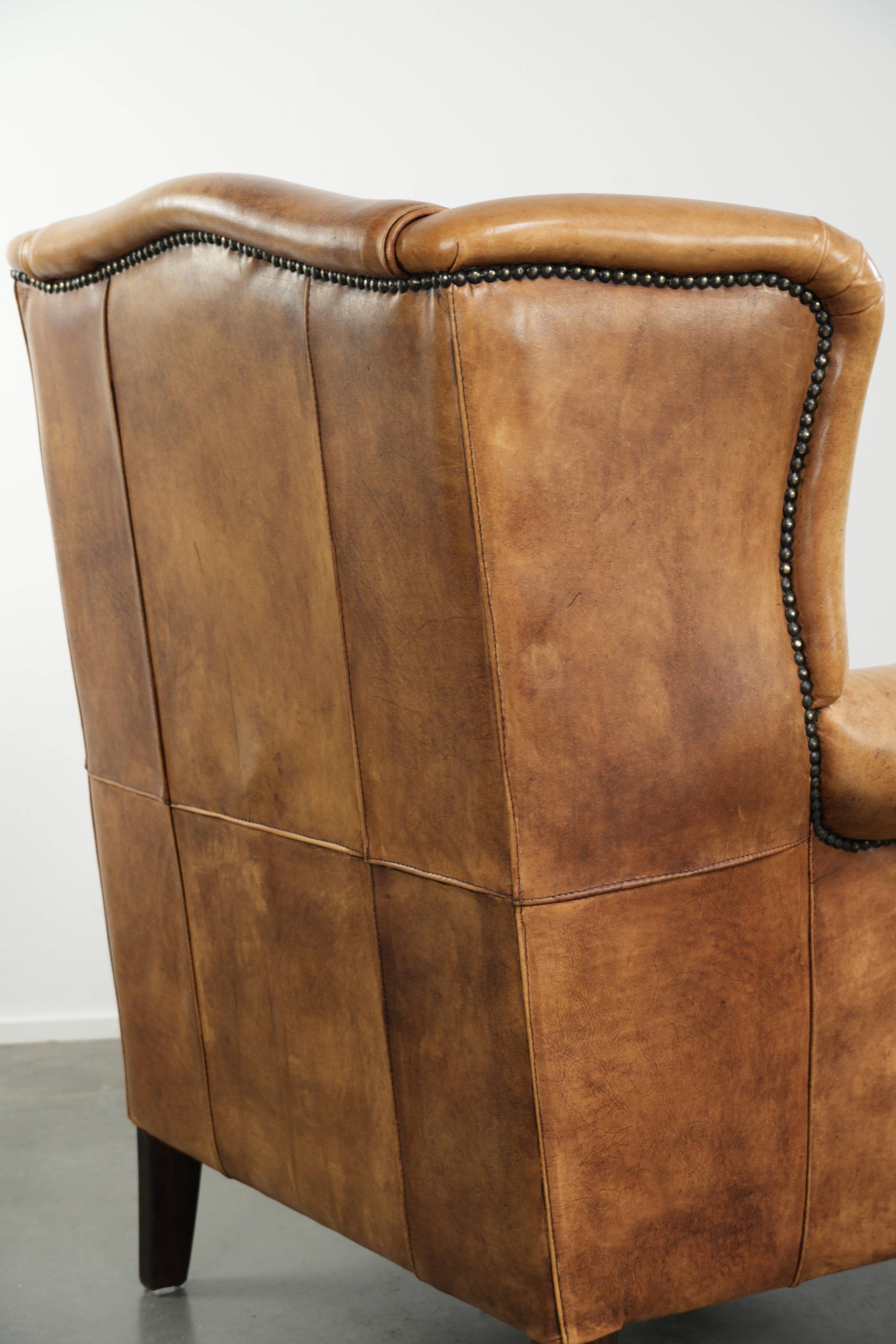 Cow leather wingback armchair with a beautiful timeless English look