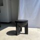 Black mango wood tripod side table with a semi-spherical top, height: 45 cm, diameter: 44 cm.