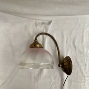 Brass wall light with a glass globe dimension: height -21cm- width -27cm-