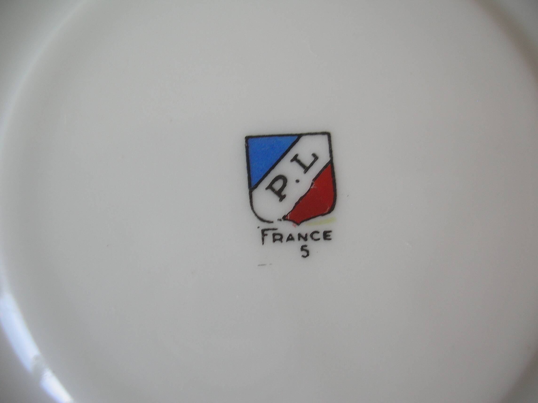 Old large tea cup and saucer in Limoges porcelain with flower decor