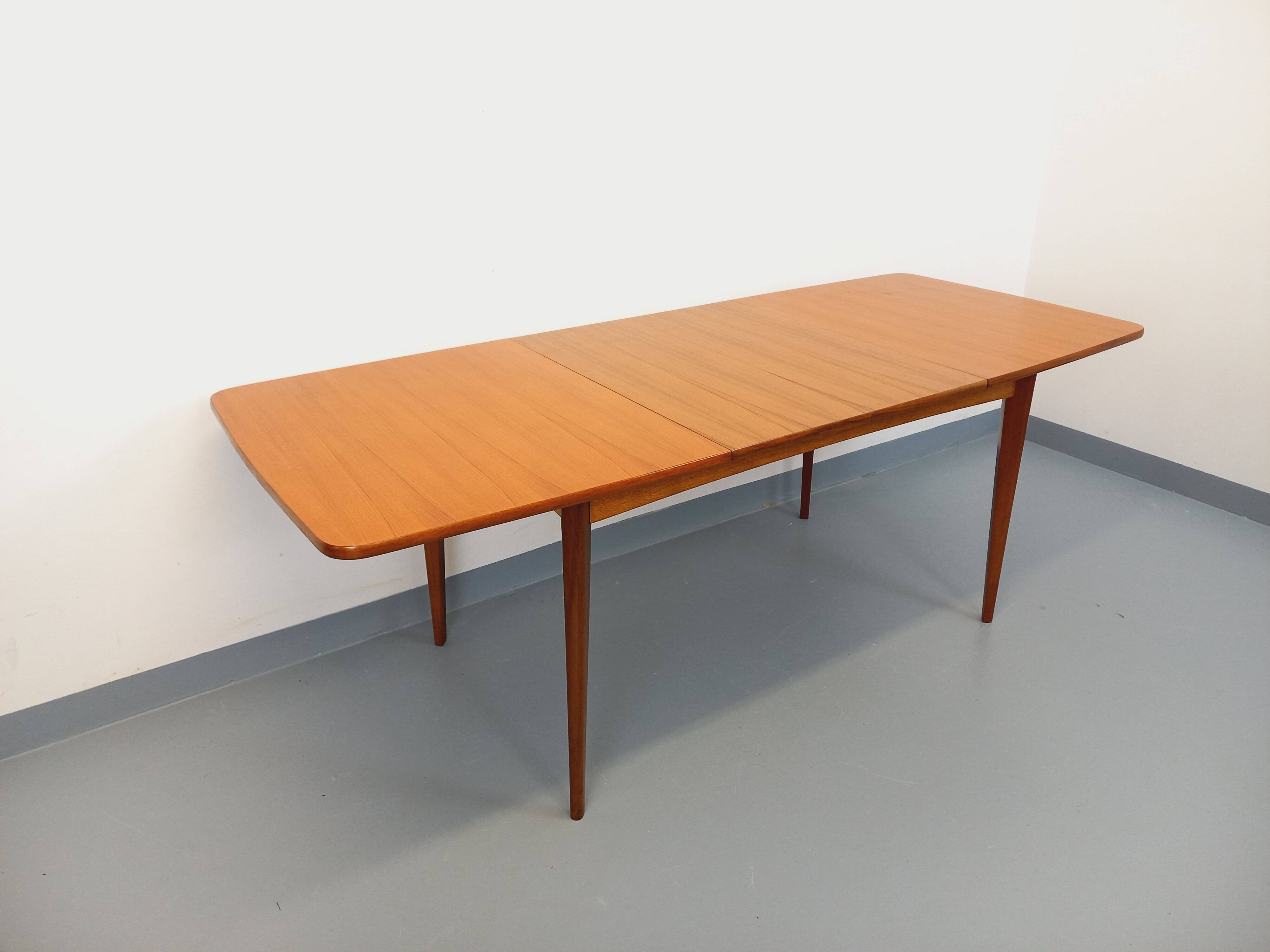 Rectangular dining table in vintage Scandinavian style from the 50s and 60s, made of teak.