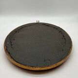 Antique oval gilded mirror with wooden frame and stucco detail