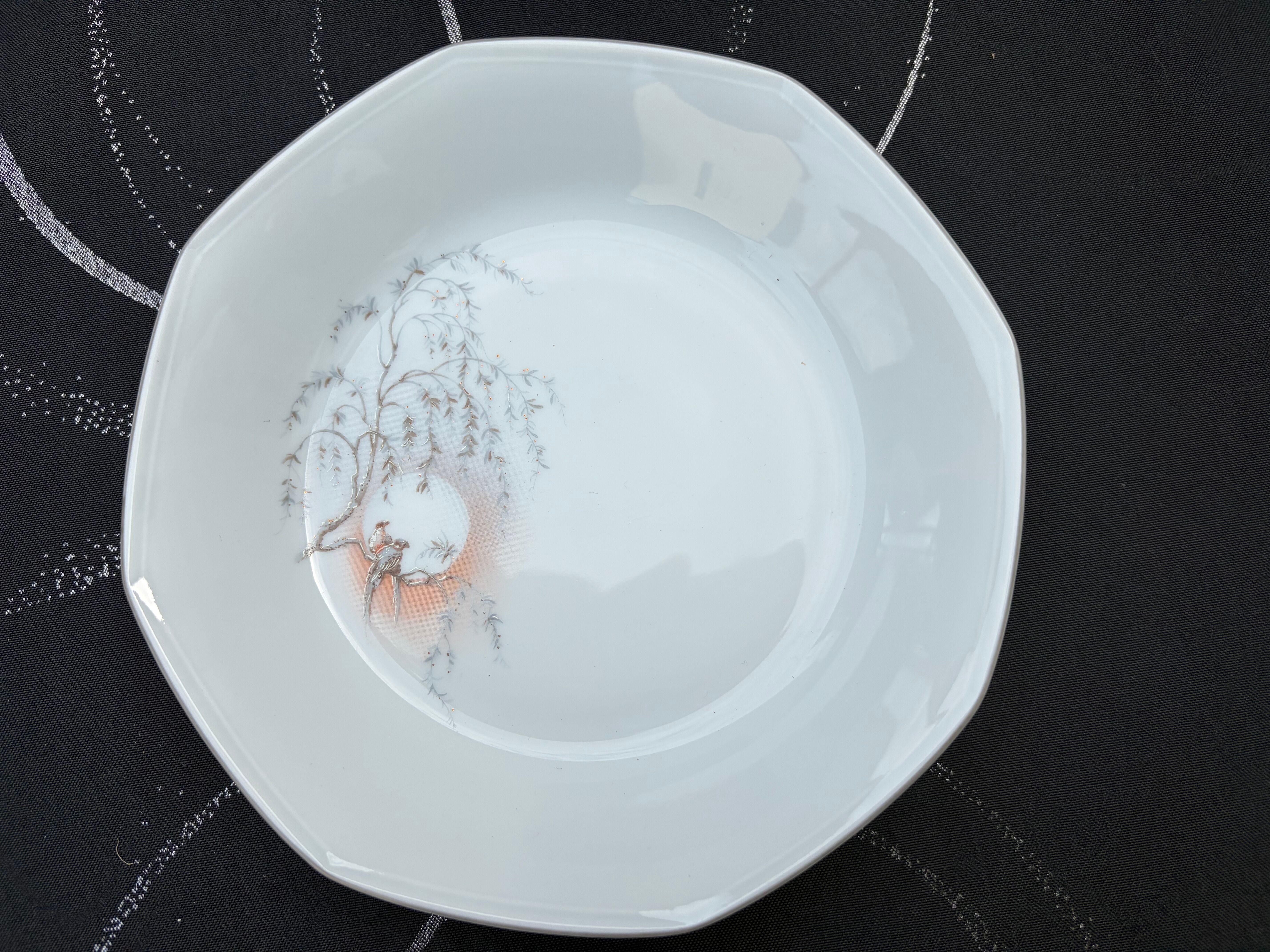 Set of 12 deep porcelain plates from Sologne.