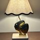 Brass lamp in the shape of a fish by Somchai Hattakitkosol.